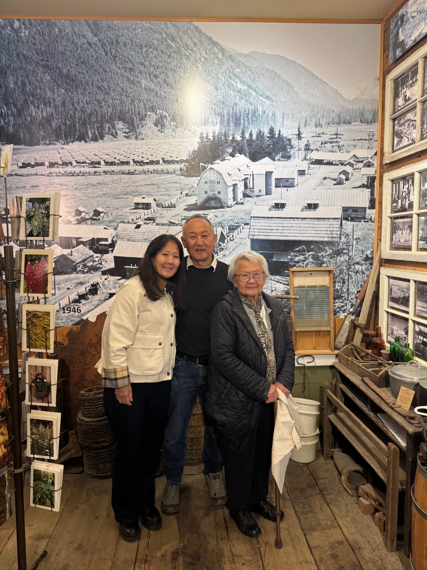 Standing before a mural of the valley at a Japanese-Canadian history exhibit